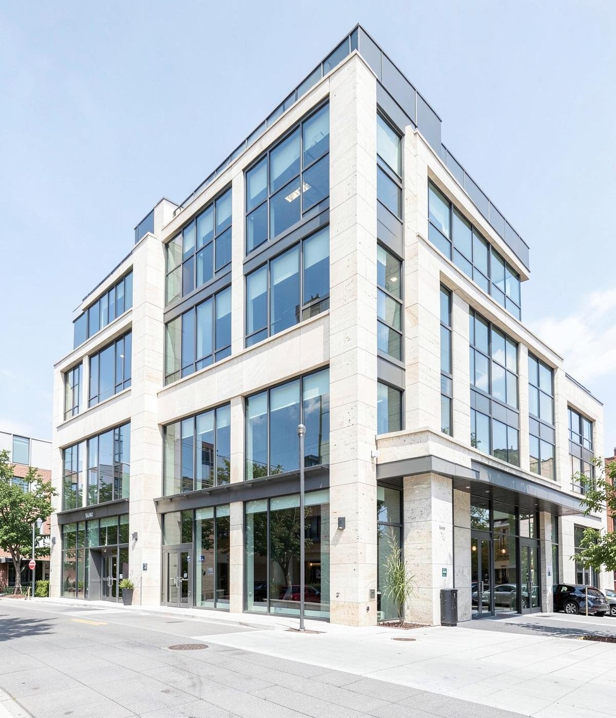 Contemporary commercial building in light stone and glass